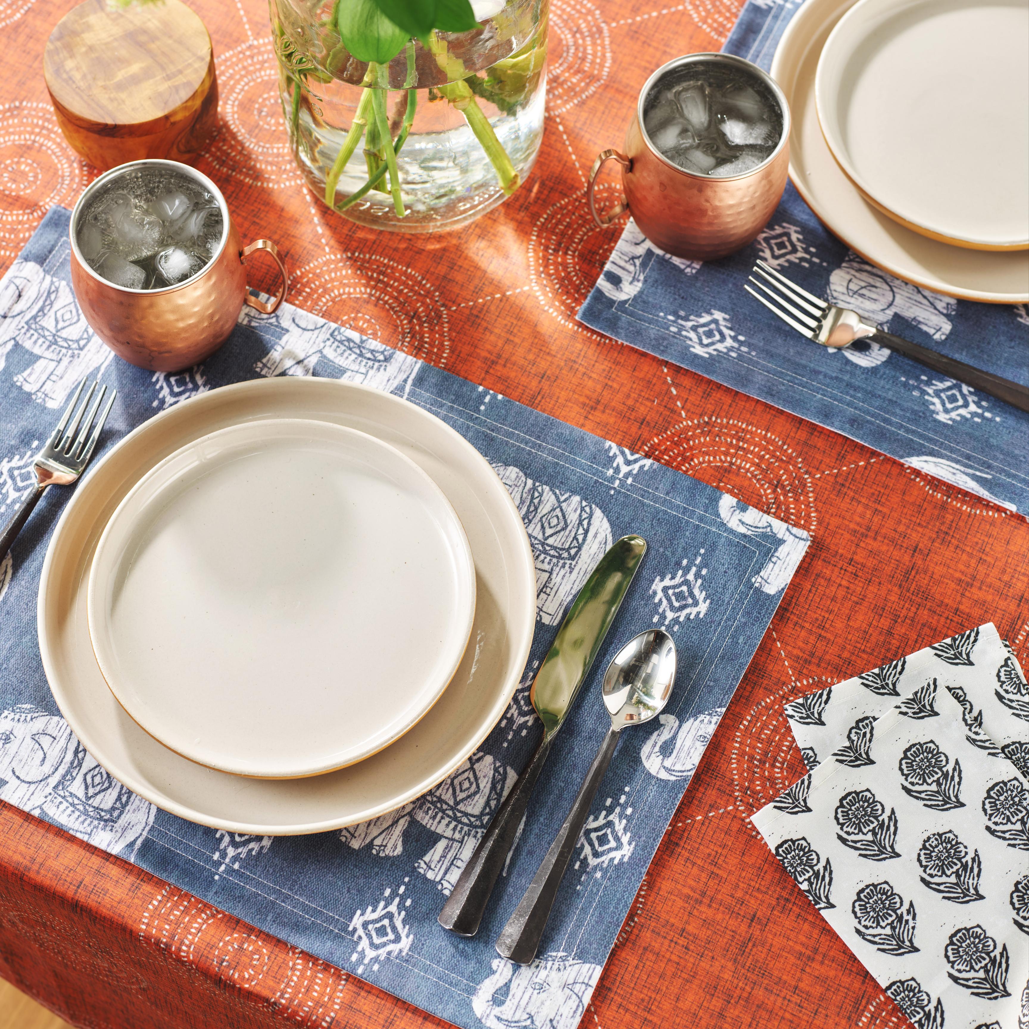 Placemats set on dining table with plates