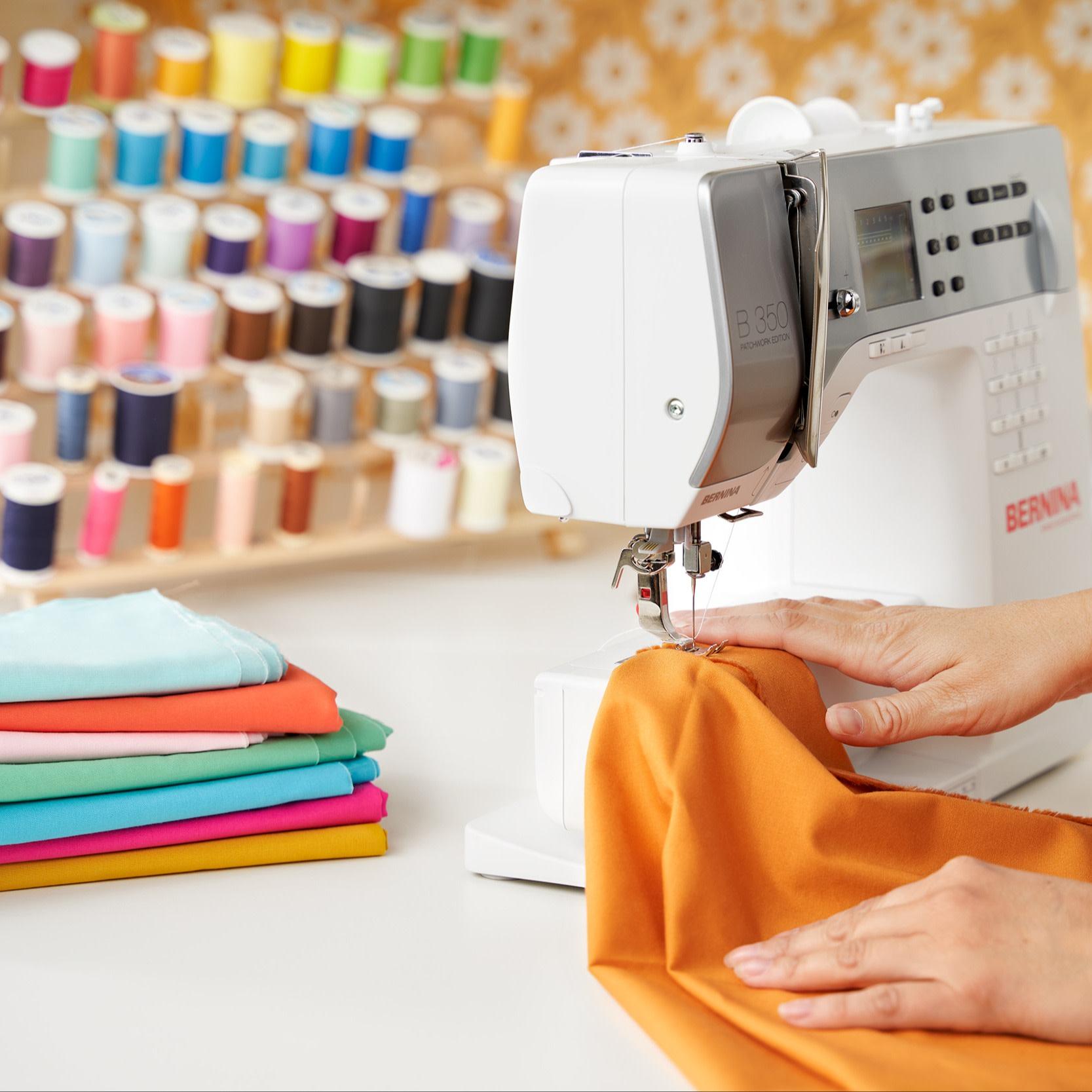 Hands using a sewing machine