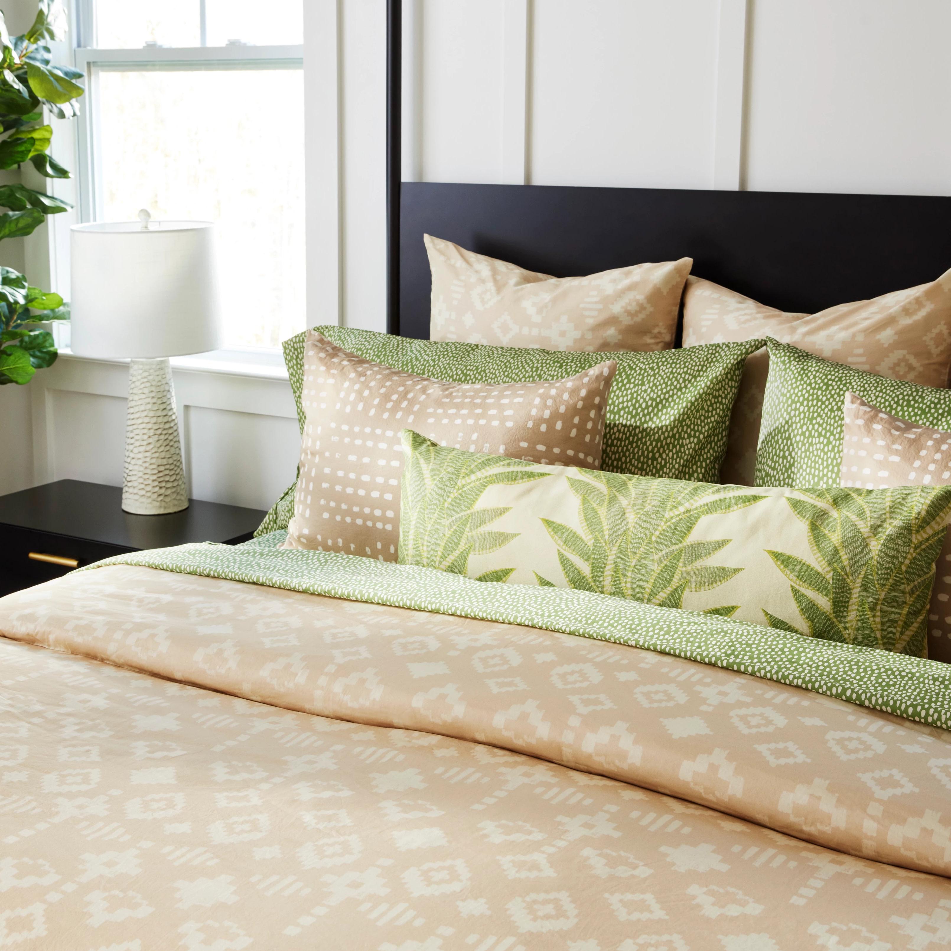 Tan and green Spoonflower bedding.