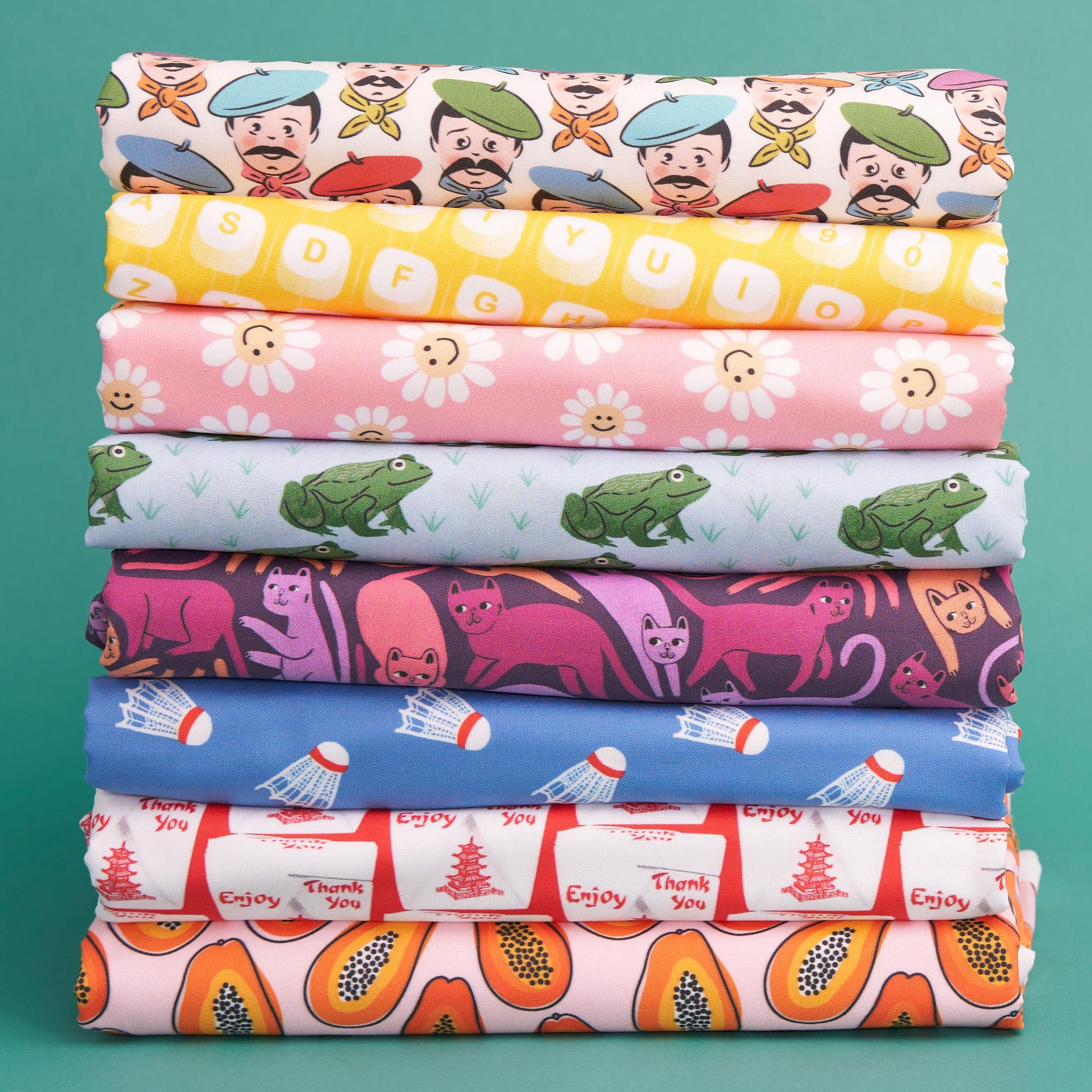 Stack of novelty printed fabrics