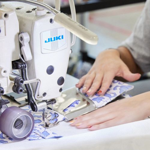 Person sewing Spoonflower home decor on sewing machine