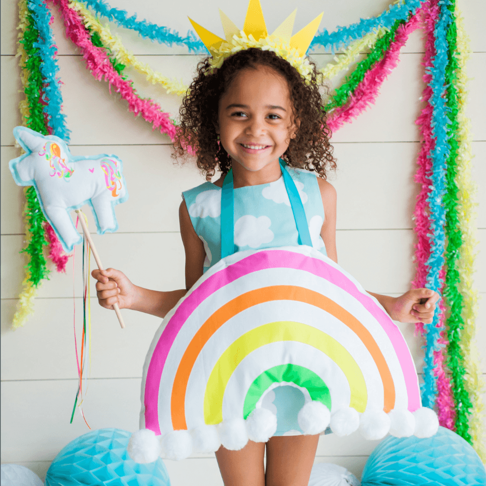 Girl wearing rainbow costume