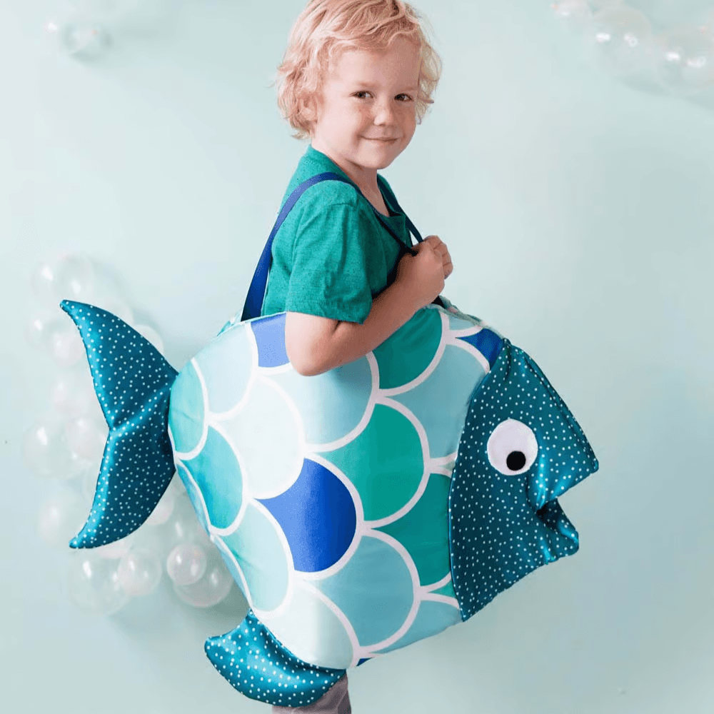 Child wearing fish costume